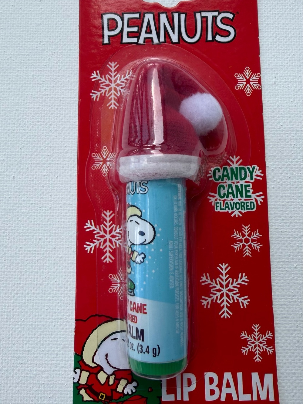 Peanuts Candy Cane Lip Balm with Snoopy Holiday Hat - Red, White, Blue, Green